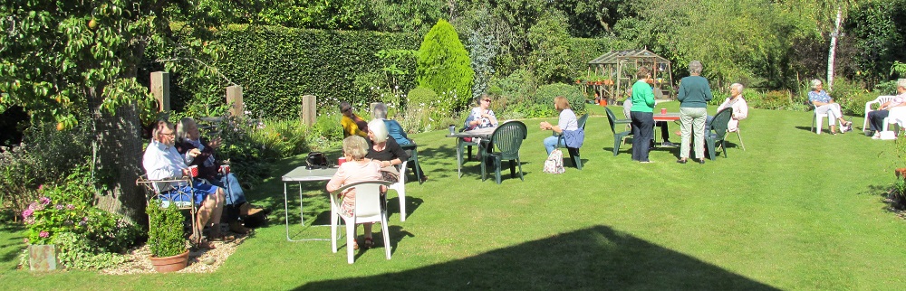 Members enjoying Val Aitken's garden