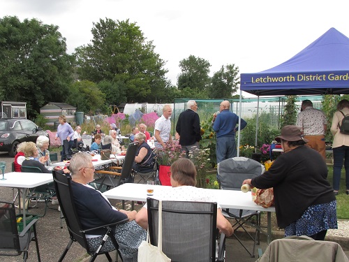 Garden party - members sitting around enjoying the evening