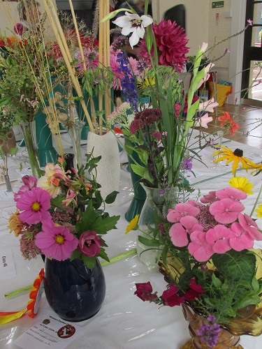 Vases of mixed flowers at Weston Show